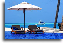 Deck Chairs and Parasol::Rangalifinolhu Island, Maldives::