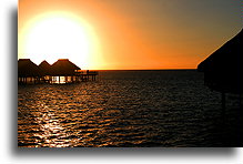 Sun Disk and Bungalows::Moorea, French Polynesia::